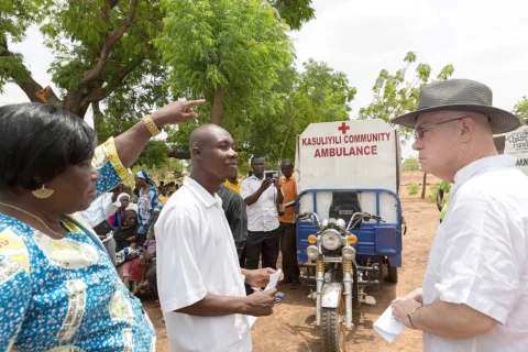 People talking during a community visit in Ghana.